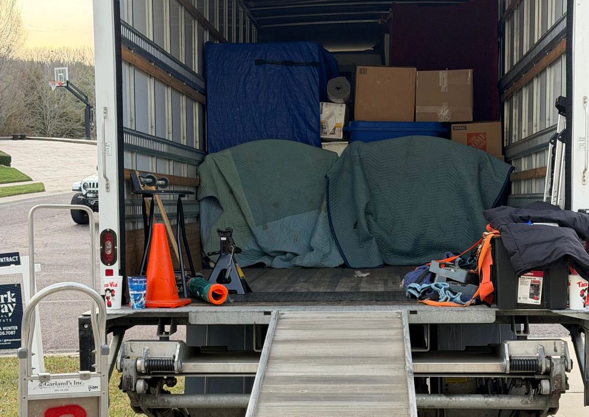A God's Movers box truck parked outside a Kansas City home